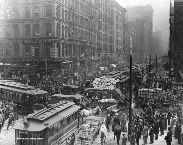 Traffic congestion, including several trolleys and horse-drawn carts, on Dearborn Street south from Randolph Street in Chicago in 1909. (Frank M. Hallenbeck/Chicago History Museum)