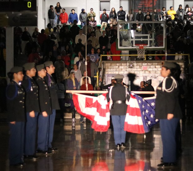 Presenting the colors at a Waukegan High School basketball game are members of the JROTC. (Photo courtesy of Waukegan Community Unit School District 60)