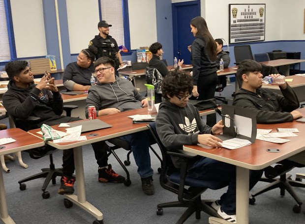 Students at the Waukegan Youth Citizen Police Academy listen in class. (Steve Sadin/For the Lake County News-Sun)