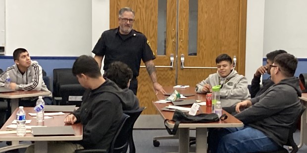 Waukegan police Sgt. Alejos Villalobos teaches students during the Waukegan Youth Citizen Police Academy. (Steve Sadin/For the Lake County News-Sun)