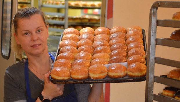 The Velvet Bakery owner Anna Kaliszak shows some of the paczkis she made for Fat Thursday in 2021. (Jeff Vorva/for the Daily Southtown)