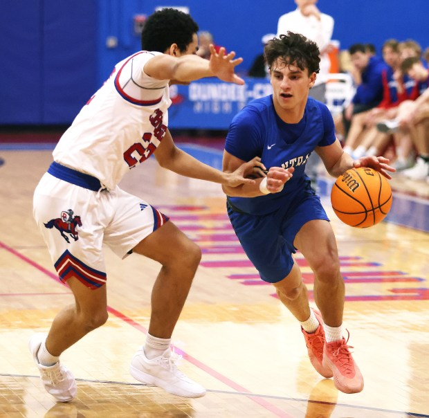 Burlington Central's Lucas Kerr (3)drives to the basket against Dundee-Crown's Anthony Jobe (22) in the fourth quarter during a Fox Valley Conference game in Carpentersville on Friday, Jan. 31, 2025.H. Rick Bamman / For the Beacon News