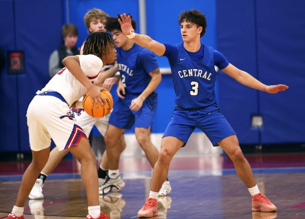 Burlington Central's Lucas Kerr (3) guards Dundee-Crown's Rasheed Trice (1) in the third quarter during a Fox Valley Conference game in Carpentersville on Friday, Jan. 31, 2025.H. Rick Bamman / For the Beacon News