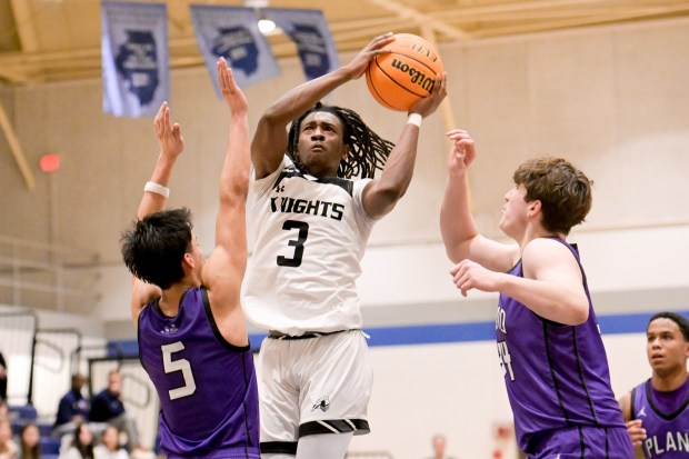 Kaneland's Marshawn Cocroft (3) moves in for a shot against Plano during a the Class 3A IMSA Regional semifinals in Aurora on Wednesday, Feb. 26, 2025. (Mark Black / for the Beacon-News)