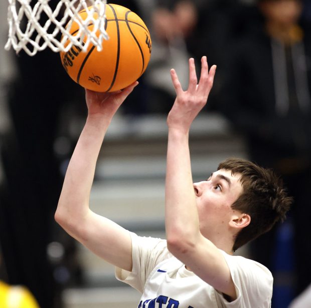 Burlington Central's Patrick Magan (13) puts up a shot for a basket in the second quarter during a Fox Valley Conference game against Jacobs Feb. 14, 2025 in Burlington. (H. Rick Bamman / The Beacon-News)