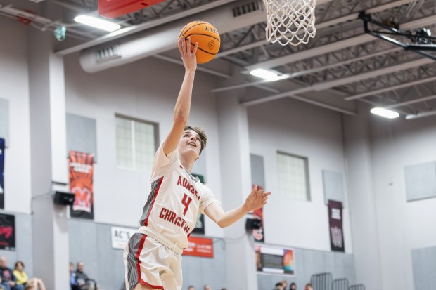 Aurora Christian's Joe DeCort (4) goes up for a layup against Leland during a Class 1A Indian Creek Regional quarterfinal in Aurora on Monday, Feb. 24, 2025. (Troy Stolt / for the Beacon News)