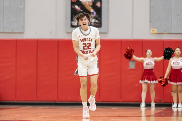 Aurora Christian's Jacob Baumann (22) celebrates after hitting a three pointer against Leland during a Class 1A Indian Creek Regional quarterfinal in Aurora on Monday, Feb. 24, 2025. (Troy Stolt / for the Beacon News)