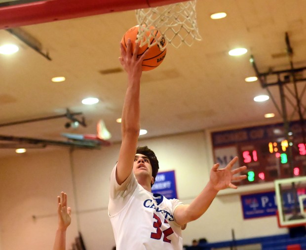 Marmion's Samuel Dalmann drives to the basket. Marmion defeated Ottawa in a boys basketball game 66-58 Tuesday, Feb. 18, 2025, in Aurora, Illinois. (Jon Langham/for the Beacon-News)