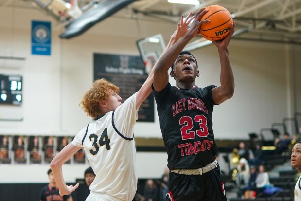 East Aurora's Davion Jackson (23) plays the ball in the post against Streamwood's Adam Hovey (34) during an Upstate Eight West conference basketball game at Streamwood High School on Thursday, Feb. 13, 2025. (Sean King / for The Beacon-News)