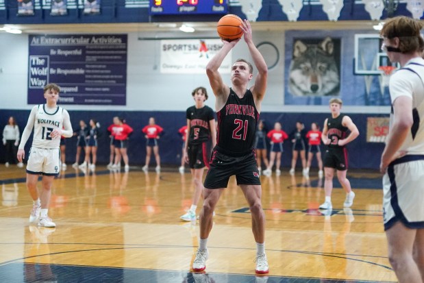 Yorkville's Taelor Clements (21) shoots a free-throw during a Southwest Prairie Conference basketball game against Oswego East at Oswego East High School on Friday, Feb. 14, 2025. (Sean King / for The Beacon-News)