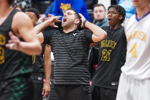 Waubonsie Valley's head coach Andrew Schweitzer (center), reacts after a call against his team late in the 4th quarter of play during an Indian Creek Shootout basketball game against Warren at Indian Creek High School in Shabonna on Saturday, Feb. 15, 2025. (Sean King / for The Beacon-News)