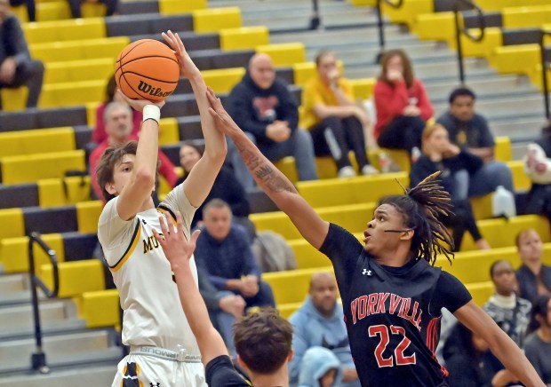 Yorkville's Braydon Porter defends against Metea Valley's Jake Nosek. Yorkville defeated Metea Valley in a boys basketball game 66-58 Tuesday, Feb. 11, 2025, in Aurora, Illinois. (Jon Langham/for the Beacon-News)