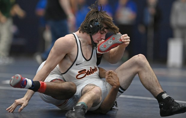 St. Charles East's Ryan McGovern wrestling Proviso West's Marquis Deloach for the championship at 157 pounds during Saturday's IHSA Class 3A Conant Sectional, Feb. 15, 2025. (Brian O'Mahoney for the The Beacon-News)