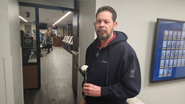 Thomas Wehner, whose 21-year-old son Trevor was killed during the mass shooting at the Henry Pratt Co. in 2019, gets ready to enter the ceremony Saturday at Aurora City Hall marking the sixth anniversary of the tragedy. (David Sharos / For The Beacon-News)