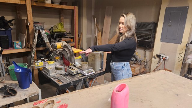 Aurora artist Chelsie Kliese shows off a work area she uses when making items from concrete. (David Sharos / For The Beacon-News)