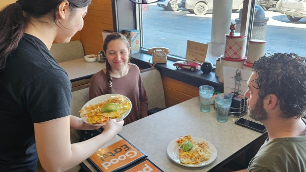 Alyse and Brian Minardi of Batavia get ready to enjoy omelets recently at Daddio's Diner in Batavia. They have heard about the restaurant's issues due to the rising cost of eggs and said they try to come in regularly to support the business. (David Sharos / For The Beacon-News)