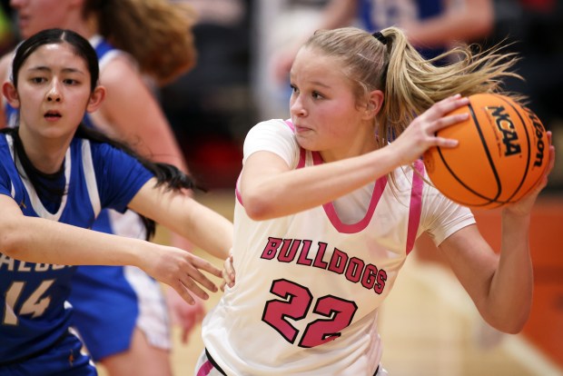 Batavia's Ali Thomas (22) looks to pass as Wheaton North's Sophia Johnson (14) defends in the fourth quarter during a Class 4A St. Charles East Sectional semifinal game in St. Charles on Tuesday, Feb. 25, 2025.H. Rick Bamman / For the Beacon-News