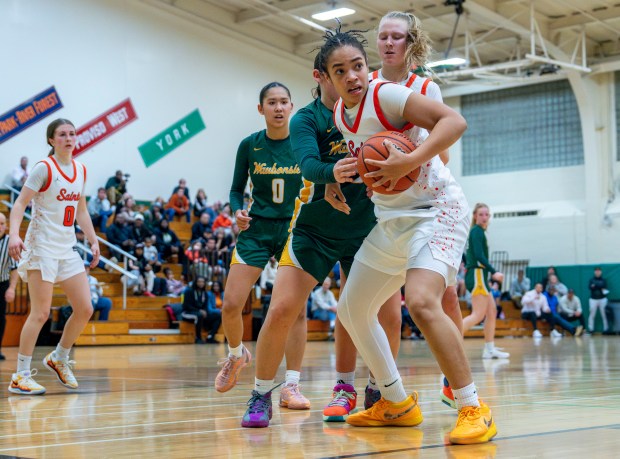 St. Charles East's Corinne Reed (35) looks for an opening during the York Thanksgiving Tournament at York Community High School in Elmhurst, IL, on Monday, Nov. 18, 2024. (Nate Swanson / for the Beacon-News)