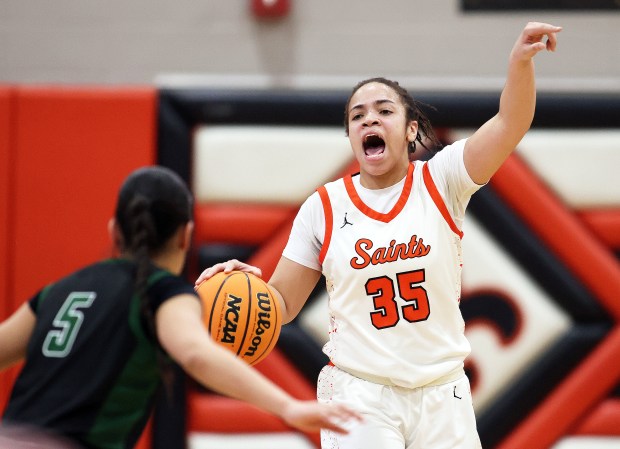 St. Charles East's Corinne Reed (35)shouts to set up a play against Glenbard West's Lauren Escalante (5) in the second quarter during a Class 4A St. Charles East Sectional semifinal game in St. Charles on Tuesday, Feb. 25, 2025.H. Rick Bamman / For the Beacon-News