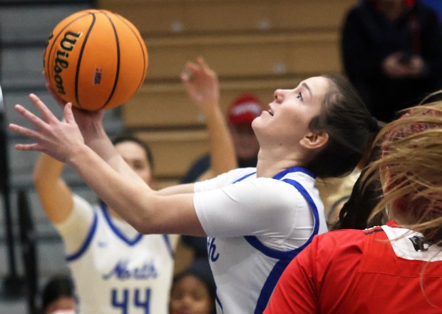 St. Charles North's Hannah Ganser (4) slices through Proviso West defenders during the Class 4A St. Charles North Regional semifinal game in St. Charles on Tuesday, Feb. 18, 2025.H. Rick Bamman / For the Beacon News