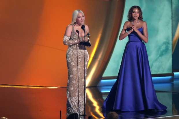 Beyonce accepts the award for album of the year for "COWBOY CARTER during the 67th annual Grammy Awards on Sunday, Feb. 2, 2025, in Los Angeles. Blue Ivy Carter looks on from right.(AP Photo/Chris Pizzello)