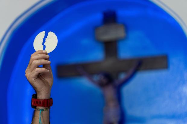 Priest Agustin Lopez leads a Mass for the health of Pope Francis at Caacupe church in the Carlos Mugica neighborhood in Buenos Aires, Argentina on Feb. 23, 2025. (Rodrigo Abd/AP)