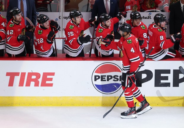 Blackhawks defenseman Seth Jones (4) celebrates after scoring the only goal for the team in the second period of a preseason game against the Wild at the United Center on Oct. 4, 2024, in Chicago. (John J. Kim/Chicago Tribune)