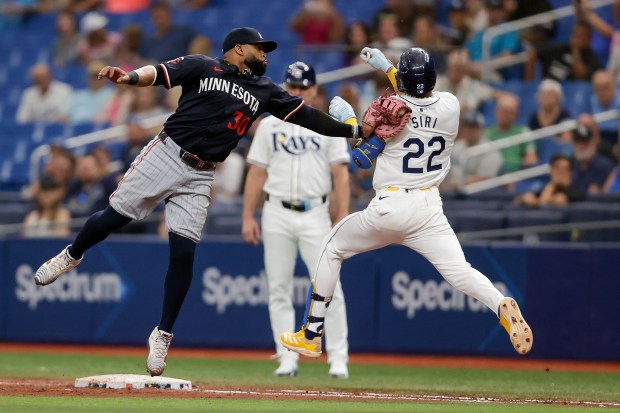 Twins first baseman Carlos Santana tags out Rays outfielder Jose Siri for the final out of the game on Sept. 5, 2024, at Tropicana Field. (Luis Santana/Tampa Bay Times/TNS)