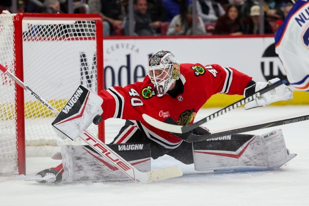 Blackhawks goaltender Arvid Söderblom blocks a shot by Oilers defenseman Darnell Nurse on Feb. 5, 2025, at the United Center. (Armando L. Sanchez/Chicago Tribune)