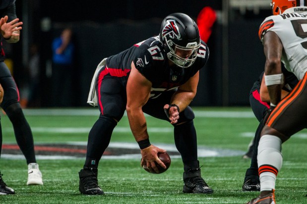 Falcons center Drew Dalman snaps the ball during a preseason game against the Browns on Aug. 29, 2021, in Atlanta. (AP Photo/Danny Karnik)