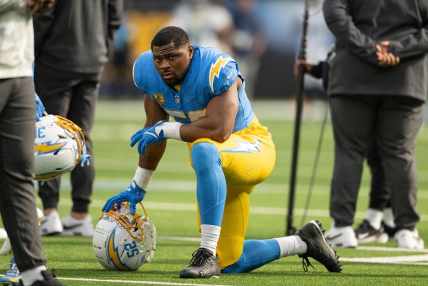 Chargers linebacker Khalil Mack kneels on the field before a game against the Titans on Nov. 10, 2024, in Inglewood, Calif. (AP Photo/Kyusung Gong)