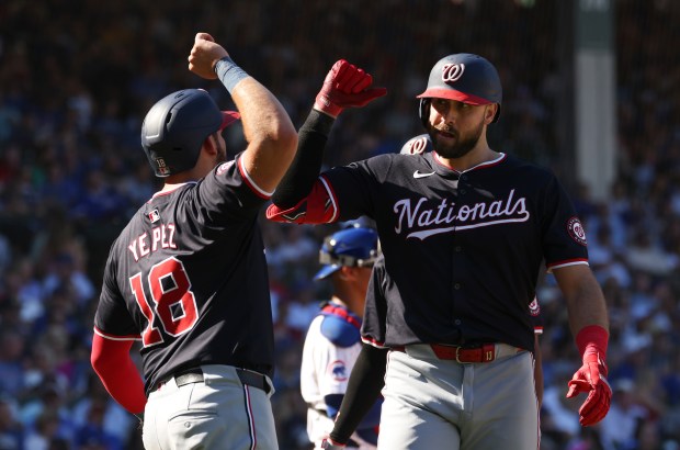 Nationals right fielder Joey Gallo, right, celebrates after hitting a three-run home run against the Cubs on Sept. 21, 2024, at Wrigley Field. (John J. Kim/Chicago Tribune)