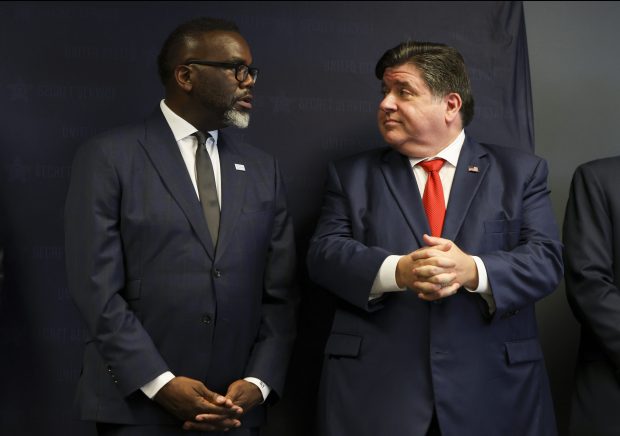 Mayor Brandon Johnson, left, and Gov. JB Pritzker chat together at a news conference in the lead-up to the 2024 Democratic National Convention on July 25, 2024. (Eileen T. Meslar/Chicago Tribune)