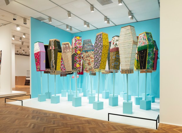 The coffins in Ebony G. Patterson's "Invisible Presence: Bling Memories," 2014, were originally carried through the streets of Kingston in Jamaica in a carnival-esque performance. Part of the exhibition "Project a Black Planet" at the Art Institute. (Provided by AIC)