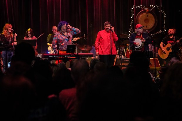 Tributosaurus members Chris Neville, center left, Matt Spiegel, center, and Curt Morrison perform "One Hit Wonders of the 70s" at Theater on the Lake in Chicago on Feb. 14, 2025. (Audrey Richardson/Chicago Tribune)