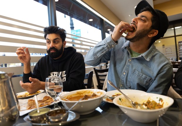 Saagar Shaikh, eats dinner with Deli Boys showrunner Abdullah Saeed at Ali's Nihari & BBQ in the West Ridge neighborhood. (Talia Sprague/for Chicago Tribune)