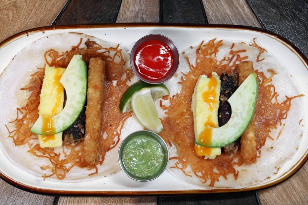 The breakfast tacos with salsas on the side at Mariscos San Pedro. (Terrence Antonio James/Chicago Tribune)