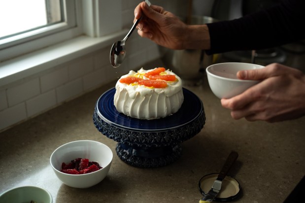 Pavlova topped with lemon curd and citrus for Valentine's Day recipe. (E. Jason Wambsgans/Chicago Tribune)