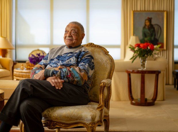 George E. Johnson, 97, in his Chicago home, Feb. 18, 2025. Johnson founded Johnson Products Co., the maker of Afro Sheen and many other products. "By 1960, I was profit sharing," he said. "My feeling was, look, these people helped make my money, why not share it?" (Brian Cassella/Chicago Tribune)