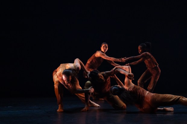 Dancers Aaron Choate, Michele Dooley, Jacqueline Burnett, Cyrie Topete and Simone Stevens in "Into Being" by FLOCK in Hubbard Street Dance Chicago's Winter Series at the Harris Theater in Chicago. (Michelle Reid)