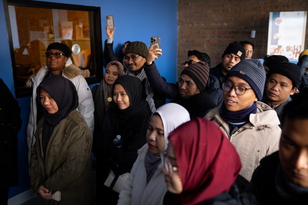 A delegation of Indonesian students tour the Salaam Community Wellness Center in the Woodlawn neighborhood during the Chicago Black Muslim History Tour, Dec. 6, 2024. (E. Jason Wambsgans/Chicago Tribune)