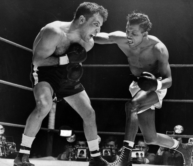 It took Sugar Ray Robinson 13 rounds to beat Jake LaMotta to claim the world middle weight title in front of more than 14,000 fans at Chicago Stadium on Feb. 14, 1951. (Chicago Tribune archive)