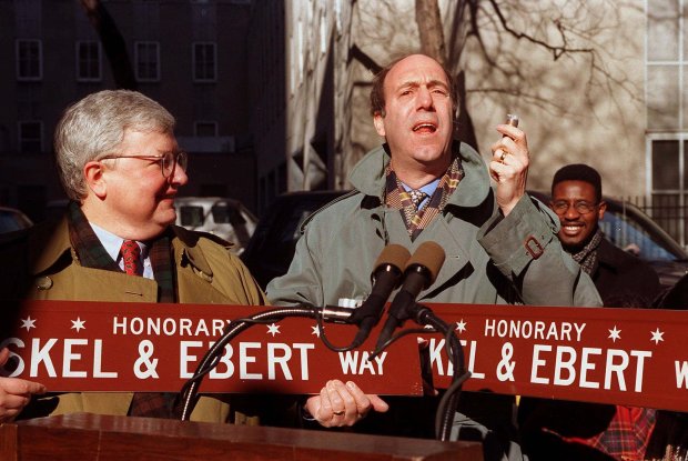 Movie critics Gene Siskel, right, and Roger Ebert, left, speak at an event renaming Erie Street at McClurg Court in their honor on Feb. 1, 1995, in Chicago. (Chris Walker/Chicago Tribune)