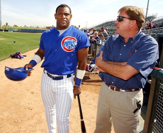 Sammy Sosa and Cubs general manager Jim Hendry chat before the Cactus League opener Feb. 28, 2002, in Scottsdale, Ariz. (Phil Velasquez/Chicago Tribune)