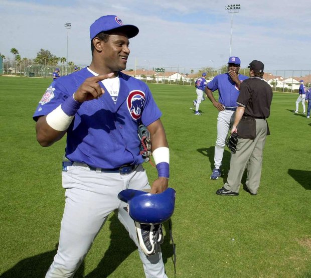 Sammy Sosa poses for the cameras as he participates in his first practice at spring training Feb. 26, 2001, in Mesa, Ariz. (Phil Velasquez/Chicago Tribune)