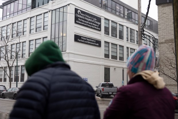 Ben Garcia and his mother Michelle Vallet head to his gender care appointment at an Ann & Robert H. Lurie Children's Hospital of Chicago outpatient center on Feb. 12, 2025. (Eileen T. Meslar/Chicago Tribune)