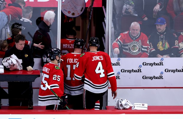 Blackhawks defenseman Alec Martinez (25), left wing Nick Foligno (17) and defenseman Seth Jones head to the locker room after a loss to the Oilers on Jan. 11, 2025, at the United Center. (Chris Sweda/Chicago Tribune)