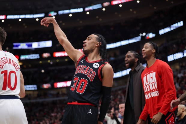 Chicago Bulls guard Tre Jones (30) looks after making a three-point shot during the fourth quarter against the LA Clippers at the United Center Wednesday Feb. 26, 2025, in Chicago. (Armando L. Sanchez/Chicago Tribune)