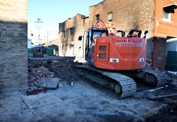 Heavy equipment operators level a building on Feb. 17, 2025, after an explosion Saturday afternoon in the 2200 block of Central Avenue in Cicero. (Antonio Perez/Chicago Tribune)