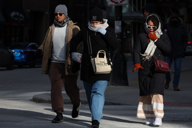 Chicagoans brave cold temperatures with degree wind chills in Chicago on Feb. 18, 2025. (Audrey Richardson/Chicago Tribune)